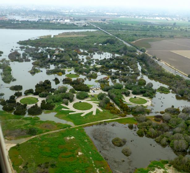 The Santa Clara River flooding at its peak covered all the campsites under a steady lake of water. Ventura Harbor is visible at upper left. Photo courtesy of Josh Pace.
