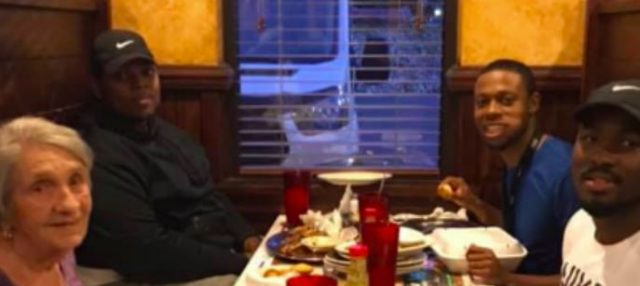Man And His Friends Invite Elderly Woman To Eat Dinner With Them After Seeing Her Eat Alone
